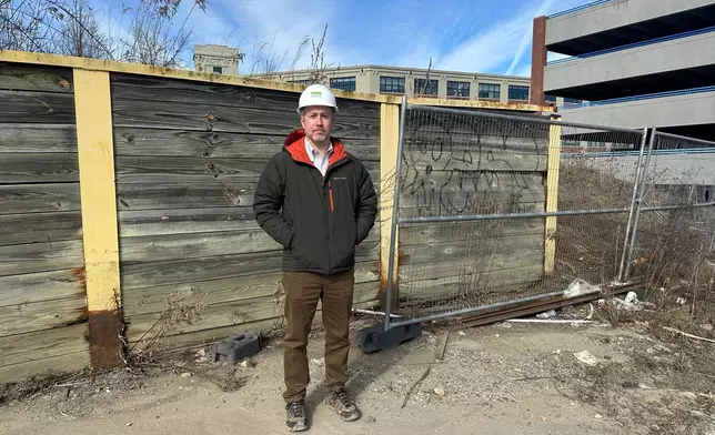 Tyler Norod, from the Westbrook Development Corporation, stands for a photo at a development site Tuesday, March 17, 2026, in Biddeford, Maine. (AP Photo/Patrick Whittle)