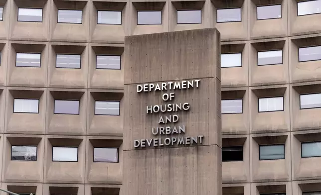 FILE - A sign for the Department of Housing and Urban Development stands outside the agency's headquarters, Jan. 16, 2026, in Washington. (AP Photo/Mark Schiefelbein, File)