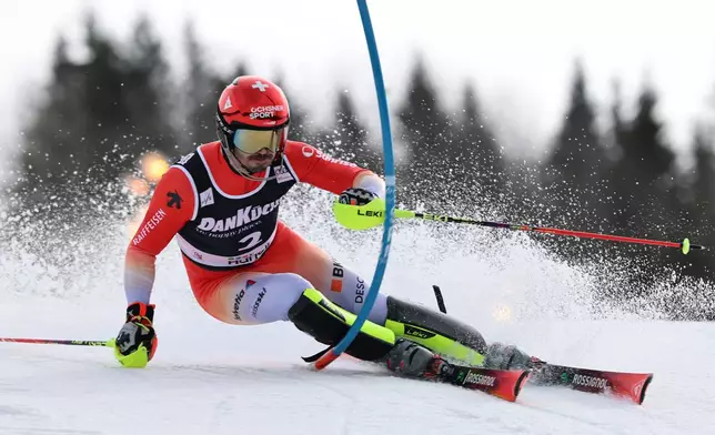 Switzerland's Loic Meillard competes in an alpine ski, men's slalom race, at the Lillehammer World Cup Finals, in Hafjell, Norway, Wednesday, March 25, 2026. (AP Photo/Marco Trovati)