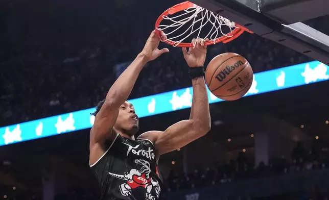 Toronto Raptors' Scottie Barnes scores against the New Orleans Pelicans during first-half NBA basketball game action in Toronto, Friday March 27 2026. (Chris Young/The Canadian Press via AP)