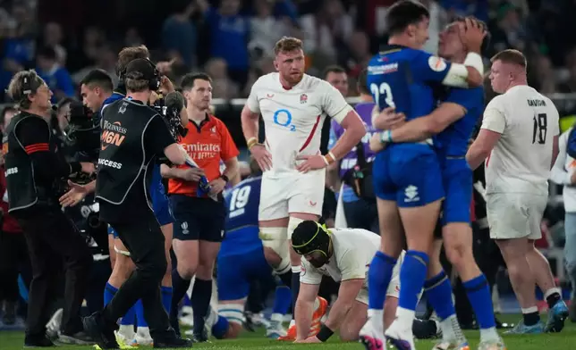 England's players stand on the pitch at the end of the Six Nations rugby union match between Italy and England in Rome, Saturday, March 7, 2026. (AP Photo/Gregorio Borgia)