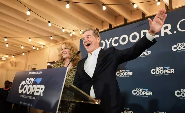 North Carolina Democratic Senate candidate former Gov. Roy Cooper speaks at a primary election night watch party Tuesday, March 3, 2026, in Raleigh, N.C. (AP Photo/Matt Ramey)