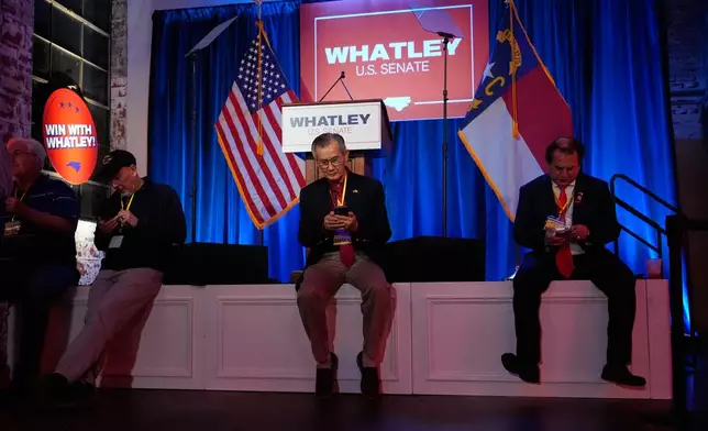 People attend the primary election night watch party for former RNC Chairman Michael Whatley, a Republican candidate for the U.S. Senate, Tuesday, March 3, 2026, in Charlotte, N.C. (AP Photo/Erik Verduzco)