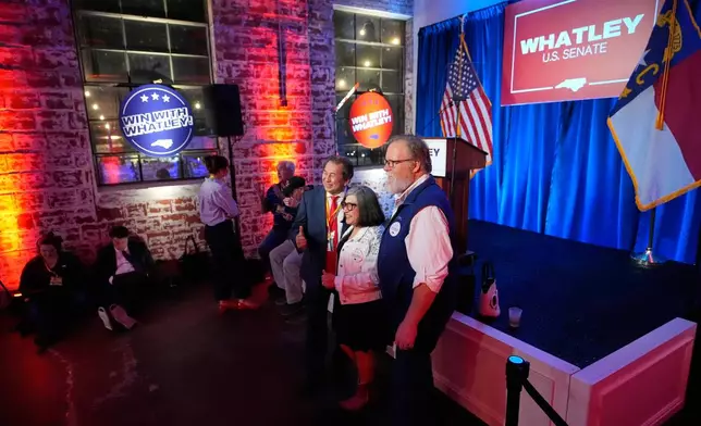 From left, Viet Tran, Lorena Castillo-Ritz and John Steward pose for a photo together at the primary election night watch party for former RNC Chairman Michael Whatley, a Republican candidate for the U.S. Senate, Tuesday, March 3, 2026, in Charlotte, N.C. (AP Photo/Erik Verduzco)