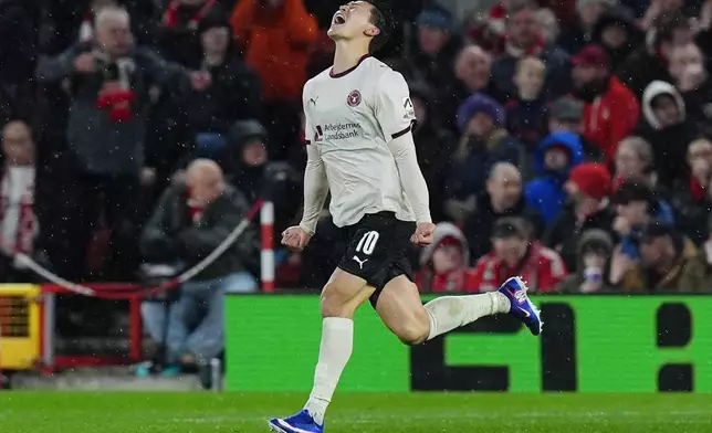 Midtjylland's Gue-Sung Cho celebrates scoring their first goal of the game during the Europa League round of 16, first leg soccer match between Nottingham Forest and FC Midtjylland in Nottingham, England, Thursday March 12, 2026. (Jacob King/PA via AP)
