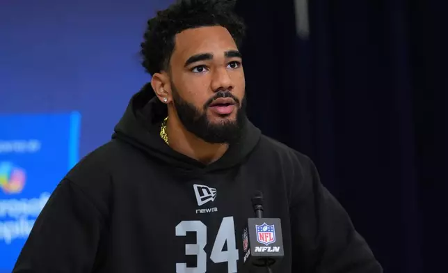 Indiana wide receiver Elijah Sarratt (34) speaks during a news conference at the NFL football scouting combine in Indianapolis, Friday, Feb. 27, 2026. (AP Photo/Julio Cortez)