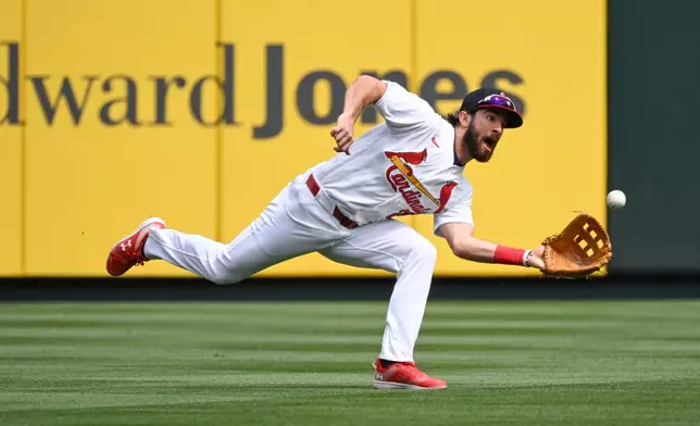 St. Louis Cardinals left fielder Thomas Saggese catches a line drive hit by Tampa Bay Rays' Junior Caminero in the first inning of a baseball game, Sunday, March 29, 2026, in St. Louis. (AP Photo/Joe Puetz)