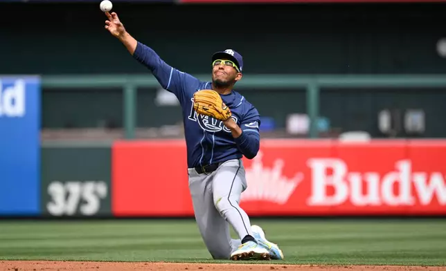 Tampa Bay Rays second baseman Richie Palacios throws out St. Louis Cardinals' Alec Burleson at first base in the first inning of a baseball game, Sunday, March 29, 2026, in St. Louis. (AP Photo/Joe Puetz)