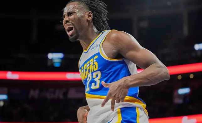 Indiana Pacers guard Aaron Nesmith (23) reacts after sinking a 3-point shot against the Orlando Magic during the second half of an NBA basketball game, Monday, March 23, 2026, in Orlando, Fla. (AP Photo/John Raoux)