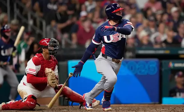 United States second baseman Brice Turang (13) hits an RBI single against Canada during the sixth inning of a World Baseball Classic quarterfinal game, Friday, March 13, 2026, in Houston. (AP Photo/David J. Phillip)