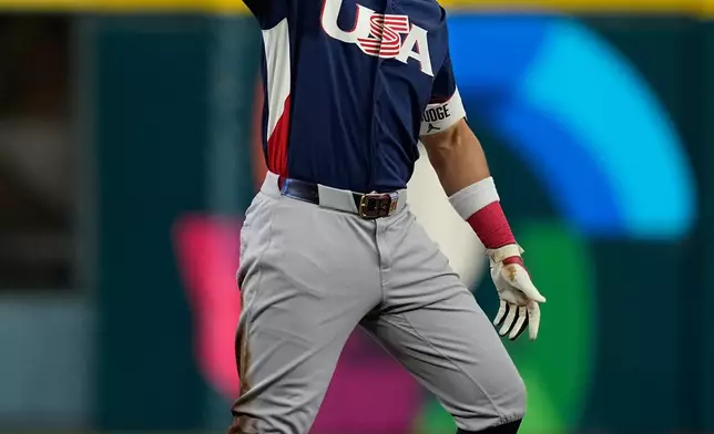 United States right fielder Aaron Judge celebrates his double against Canada during the first inning of a World Baseball Classic quarterfinal game, Friday, March 13, 2026, in Houston. (AP Photo/David J. Phillip)