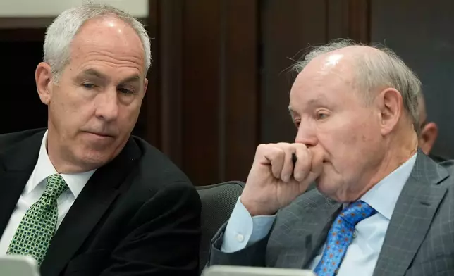 Ex-FirstEnergy Senior Vice President Michael Dowling listens to defense attorney Dan Webb during the closing arguments in former FirstEnergy CEO Chuck Jones' trial in Summit County Common Pleas Judge Susan Baker Ross's courtroom in Akron on Tuesday, March 17, 2026. (Mike Cardew/Akron Beacon Journal via AP, Pool)