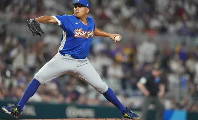 Venezuela's starting pitcher Ranger Suarez delivers a pitch during the first inning of a World Baseball Classic quarterfinal game, Saturday, March 14, 2026, in Miami. (AP Photo/Lynne Sladky)