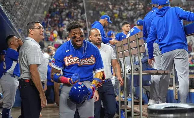 Venezuela's Ronald Acuna Jr. celebrates his single home run during the first inning of a World Baseball Classic quarterfinal game, Saturday, March 14, 2026, in Miami. (AP Photo/Lynne Sladky)