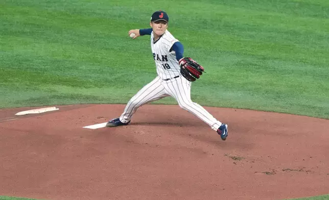 Japan's pitcher Yoshinobu Yamamoto delivers a pitch during the first inning of a World Baseball Classic quarterfinal game, Saturday, March 14, 2026, in Miami. (AP Photo/Marta Lavandier)