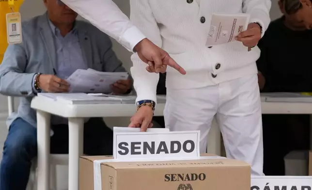 Colombia's President Gustavo Petro votes during legislative elections in Bogota, Colombia, Sunday, March 8, 2026. (AP Photo/Fernando Vergara)
