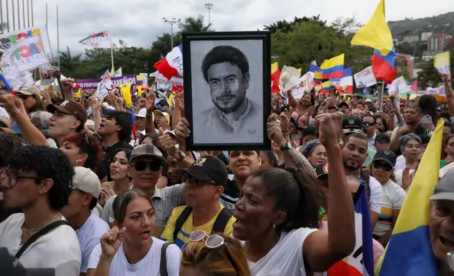 Supporters of Ivan Cepeda, presidential candidate for the Historic Pact coalition, cheer him on during a campaign rally in Cali, Colombia, Thursday, Feb. 26, 2026. (AP Photo/Santiago Saldarriaga)