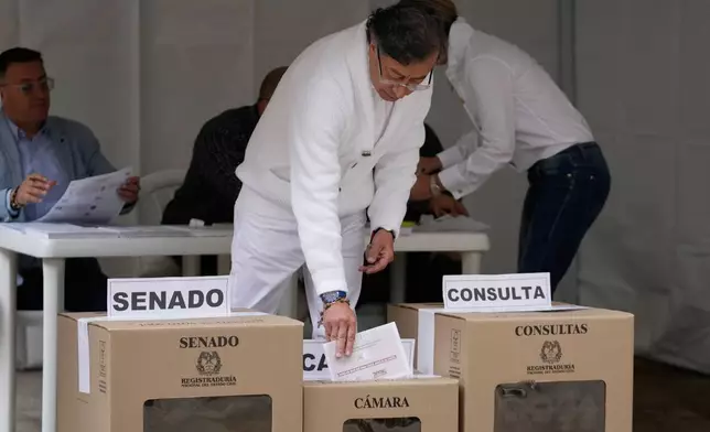 Colombia's President Gustavo Petro votes during legislative elections in Bogota, Colombia, Sunday, March 8, 2026. (AP Photo/Fernando Vergara)