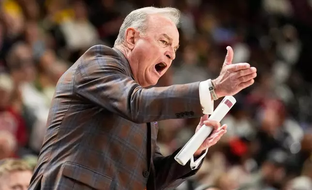 Texas head coach Vic Schaefer reacts to a call during first half of an NCAA college basketball game against Alabama in the quarterfinals of the Southeastern Conference tournament, Friday, March 6, 2026, in Greenville, S.C. (AP Photo/Chris Carlson)