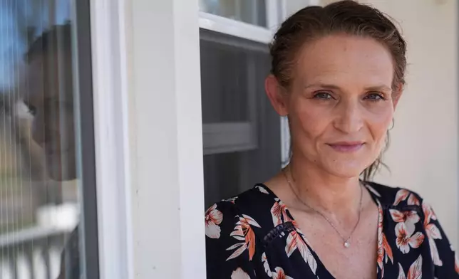 Jessica Thompson, 47, sits for a portrait at her Rockford, Ill., home on Saturday, March 21, 2026. (AP Photo/Erin Hooley)
