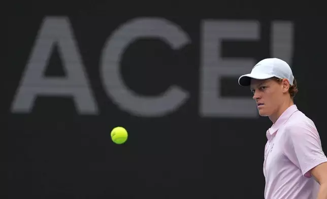 Jannik Sinner of Italy walks on the court after serving an ace against Jiri Lehecka of the Czech Republic in the men's singles final at the Miami Open tennis tournament, Sunday, March 29, 2026, in Miami Gardens, Fla. (AP Photo/Rebecca Blackwell)