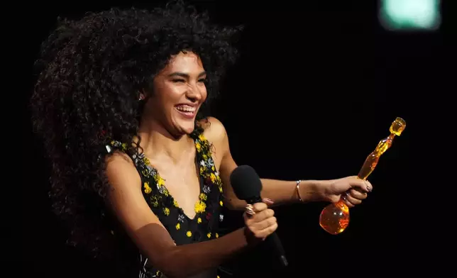 Olivia Dean wins the Pop Act award during the Brit Awards 2026 in Manchester, England, Saturday, Feb. 28, 2026. (Photo by Scott A Garfitt/Invision/AP)