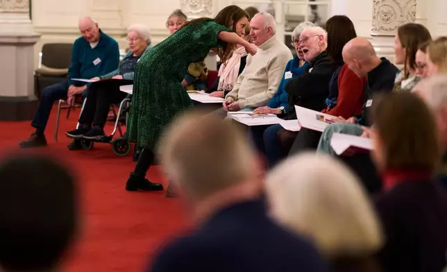 People many of them seniors with a form of dementia, join in the "singing circle" run by opera singer Maartje de Lint at the Concertgebouw concert hall in Amsterdam, on Feb. 24, 2026. (AP Photo/Peter Dejong)