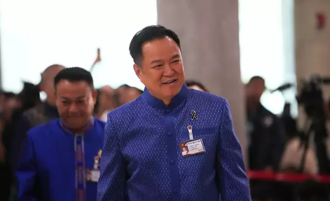 Thailand's Prime Minister Anutin Charnvirakul arrives at the parliament in Bangkok, Thailand, Thursday, March 19, 2026. (AP Photo/Sakchai Lalit)
