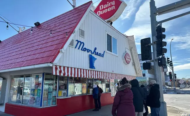 Hold for story - Customers wait their turn to place their order Sunday, March 1, 2026, during the annual opening day of the Dairy Queen in Moorhead, Minn. (AP Photo/Jack Dura)