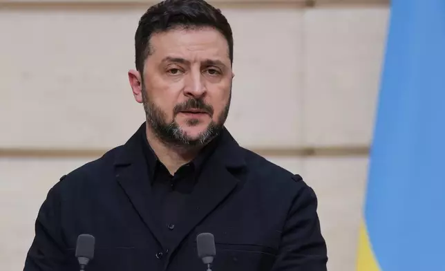 Ukraine's President Volodymyr Zelenskyy speaks during a joint presser with France's President Emmanuel Macron, not pictured, following a bilateral meeting at the Elysee Presidential Palace in Paris, Friday March 13, 2026. (Ludovic Marin/Pool Photo via AP)
