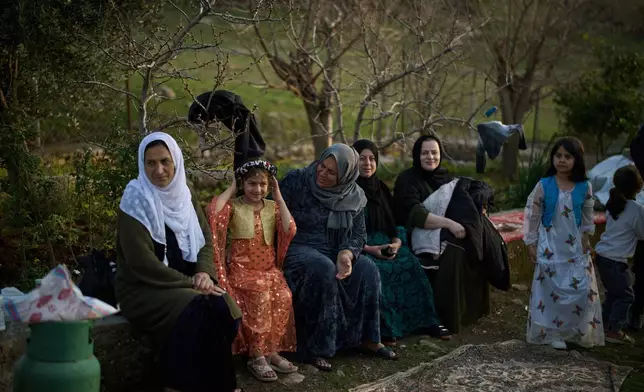 Women take part in a family gathering to break the fast with an Iftar meal during the Muslim holy month of Ramadan in the village of Gulp, Iraq, Tuesday, March 17, 2026. (AP Photo/Leo Correa)