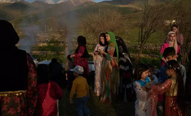 Women take part in a family gathering to break the fast with an Iftar meal during the Muslim holy month of Ramadan in the village of Gulp, Iraq, Tuesday, March 17, 2026. (AP Photo/Leo Correa)