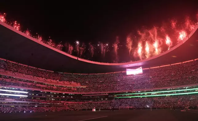 Fireworks go off at the halftime during the international friendly soccer match between Mexico and Portugal in Mexico City, Saturday, March 28, 2026. (AP Photo/Eduardo Verdugo)