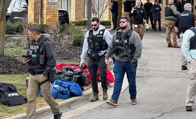 Law enforcement respond to a call at Temple Israel synagogue on Thursday, March 12, 2026, in West Bloomfield Township, Mich. (AP Photo/Corey Williams)