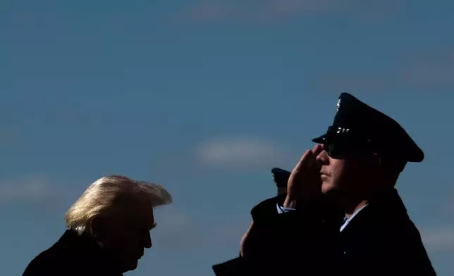 President Donald Trump walks to board Air Force One, Wednesday, March 18, 2026, at Dover Air Force Base, Del., after attending the casualty return for the six crew members of an Air Force refueling aircraft who died when their plane crashed in western Iraq while supporting operations against Iran. (AP Photo/Julia Demaree Nikhinson)
