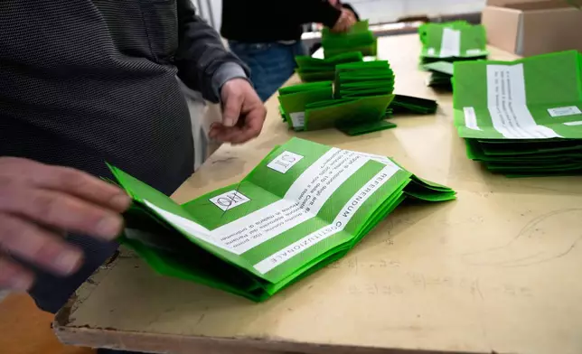 Ballots are counted at a polling station at the end of the vote for a referendum on judicial reform in Rome, Monday, March 23, 2026. (AP Photo/Gregorio Borgia)