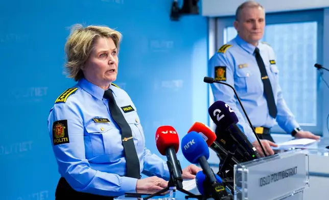 Frode Larsen, head of the Joint Unit for Investigation and Intelligence, right, and Grete Lien Metlid, head of the Joint Unit for Operational Service giving a briefing to the media in connection with the potential explosion outside the U.S. Embassy in Oslo, Sunday, March 8, 2026. (Fredrik Varfjell/NTB Scanpix via AP)