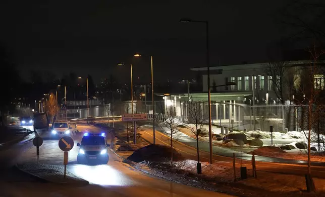 Norwegian police attend outside the U.S. Embassy in Oslo, Norway in the early hours of Sunday, March 8, 2026. (Javad Parsa/NTB Scanpix via AP)