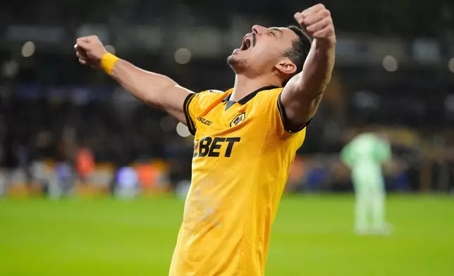 Wolverhampton Wanderers' Andre (7) celebrates after scoring their second goal of the game during an English Premier League match against Liverpool, Tuesday, March 3, 2026, in Wolverhampton, England. (Nick Potts/PA via AP)