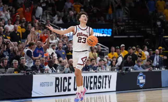Illinois' Keaton Wagler celebrates after Illinois beat Iowa in an Elite Eight game in the NCAA college basketball tournament Saturday, March 28, 2026, in Houston. (AP Photo/Eric Gay)