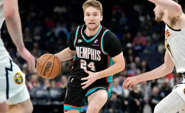 Memphis Grizzlies guard Cam Spencer (24) handles the ball against the Denver Nuggets in the second half of an NBA basketball game Wednesday, March 18, 2026, in Memphis, Tenn. (AP Photo/Brandon Dill)