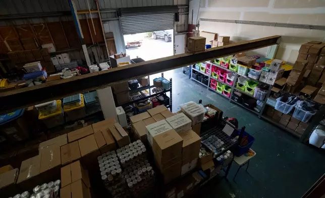 Supplies are stored inside the warehouse of Maui Rapid Response, a nonprofit supporting Maui fire survivors with cash assistance, in Kahului, Hawaii, Wednesday, March 4, 2026. (AP Photo/Mengshin Lin)