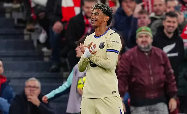 Barcelona's Lamine Yamal celebrates scoring his side's opening goal during the Spanish La Liga soccer match between Athletic Bilbao and Barcelona in Bilbao, Spain, Saturday, March 7, 2026. (AP Photo/Miguel Oses)