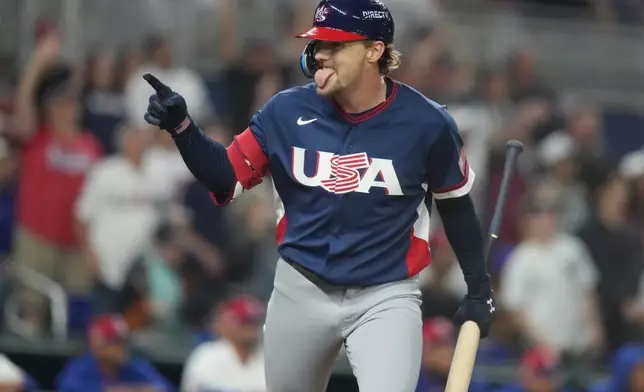 United States' Gunnar Henderson gestures to his teammates after hitting a home run during the fourth inning of a World Baseball Classic semifinal game against the Dominican Republic, Sunday, March 15, 2026, in Miami. (AP Photo/Lynne Sladky)