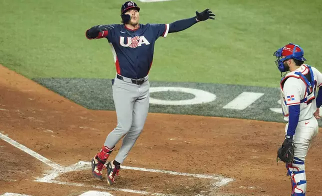 United States' Gunnar Henderson celebrates after hitting a home run during the fourth inning of a World Baseball Classic semifinal game against the Dominican Republic, Sunday, March 15, 2026, in Miami. (AP Photo/Rebecca Blackwell)