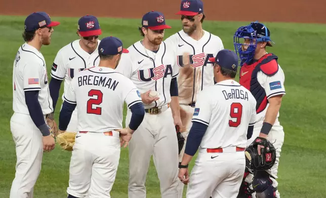 United States manager Mark DeRosa relieves United States pitcher Nolan McLean during the fifth inning in the championship game of the World Baseball Classic against Venezuela, Tuesday, March 17, 2026, in Miami. (AP Photo/Lynne Sladky)