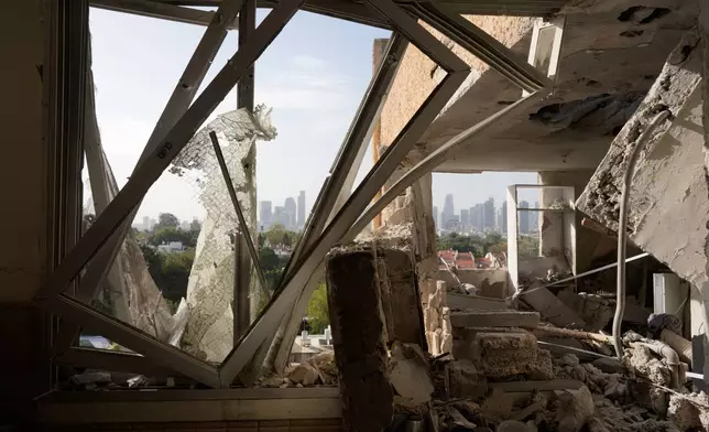 Damaged apartment following an Iranian missile strike in Tel Aviv, Israel, March 19, 2026. (AP Photo/Maya Levin)