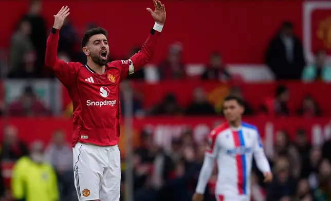 Manchester United's Bruno Fernandes celebrates after scoring during the Premiier League soccer match between Manchester United and Crystal Palace in Manchester, England, Sunday, March 1, 2026. (AP Photo/Dave Thompson)