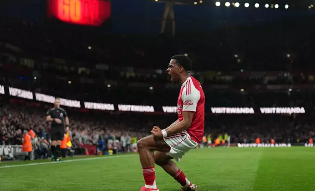 Arsenal's Jurrien Timber celebrates after scoring during the Premier League soccer match between Chelsea Arsenal in London Sunday, March 1, 2026. (AP Photo/Alastair Grant)