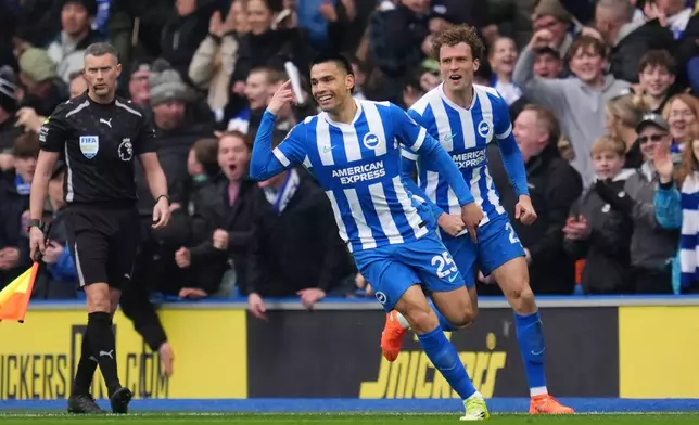 Brighton and Hove Albion's Diego Gomez, left, celebrates scoring during the English Premier League soccer match between Brighton and Hove Albion and Nottingham Forest in Brighton, England, Sunday March 1, 2026. (Adam Davy/PA via AP)